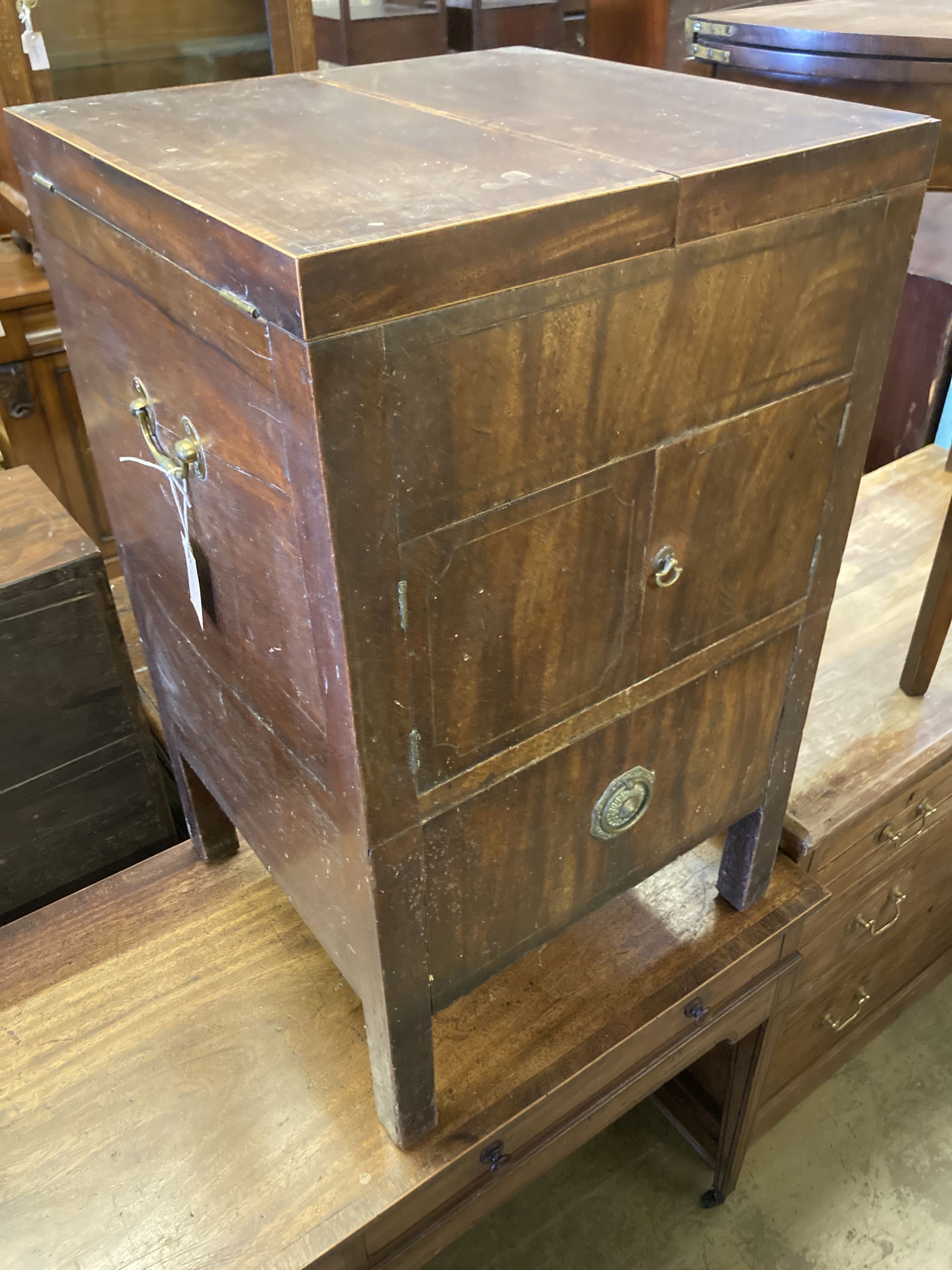 A George III cross banded mahogany enclosed wash stand, width 48cm, depth 46cm, height 79cm